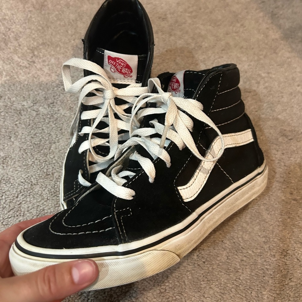 Black high top Vans. Skate boarding shoe